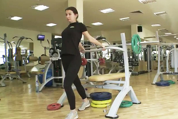 Double biceps stretching from a standing position with support behind the back